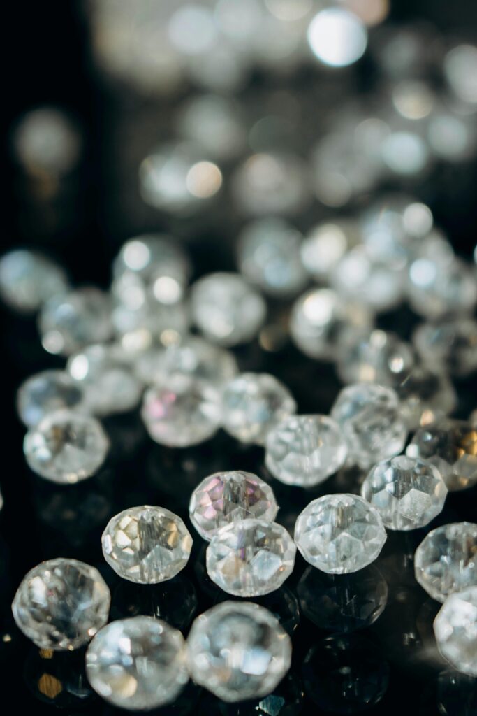 Close-up of shiny crystal beads with a beautiful bokeh effect, perfect for jewelry design.